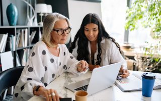women looking at the laptop